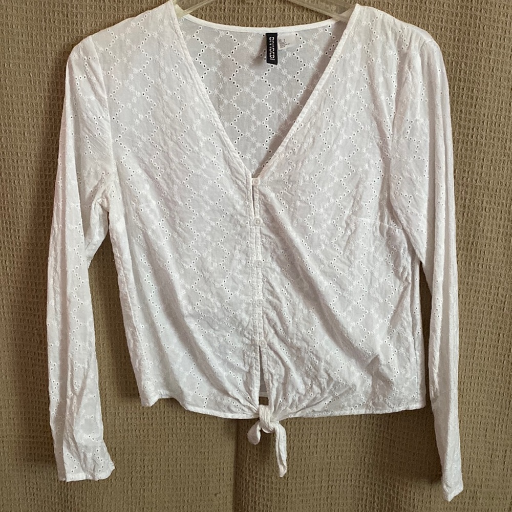 H&M white, cotton long sleeve top with flower detailing and tie at the bottom